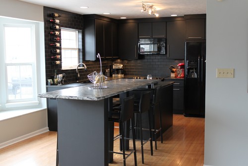 Kitchen with Flat-panel Cabinets and Subway Tile Backsplash